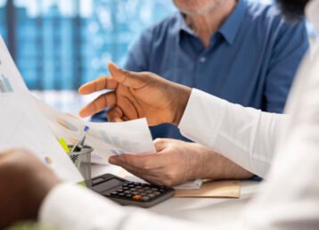 Senior people consulting with their financial banker about retirement plans